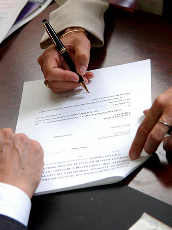 Men Signing a Contract
